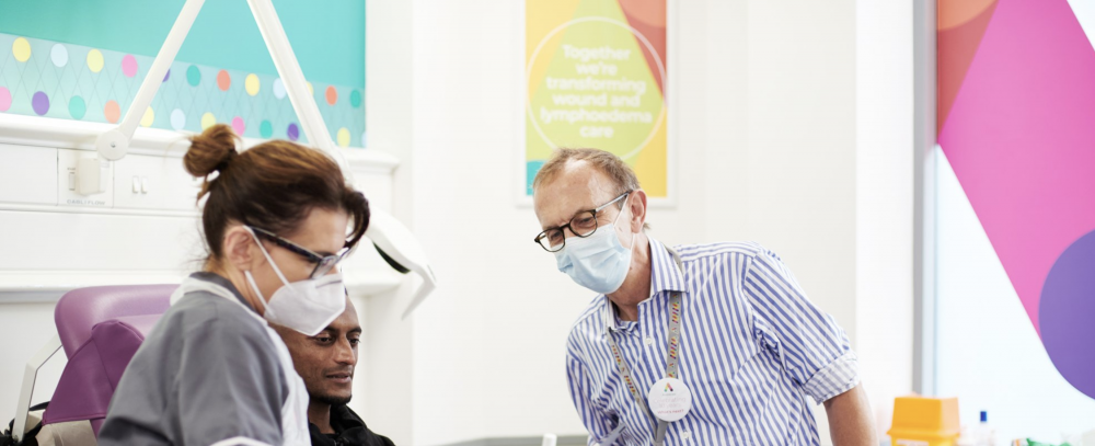 clinician, doctor and patient having leg ulcer treatment at the Acclerate centre for exellence in Hackney, London