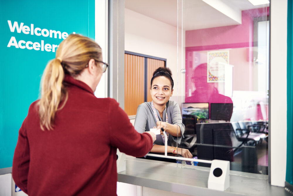 Patient talking to Accelerate receptionist